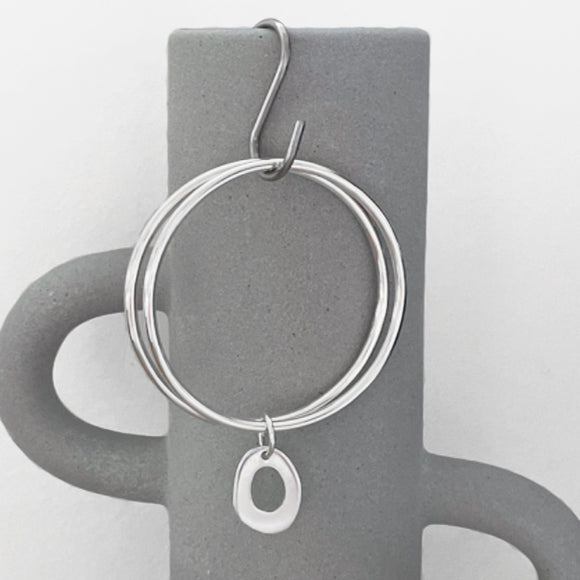 Double round bangle with open organic pendant